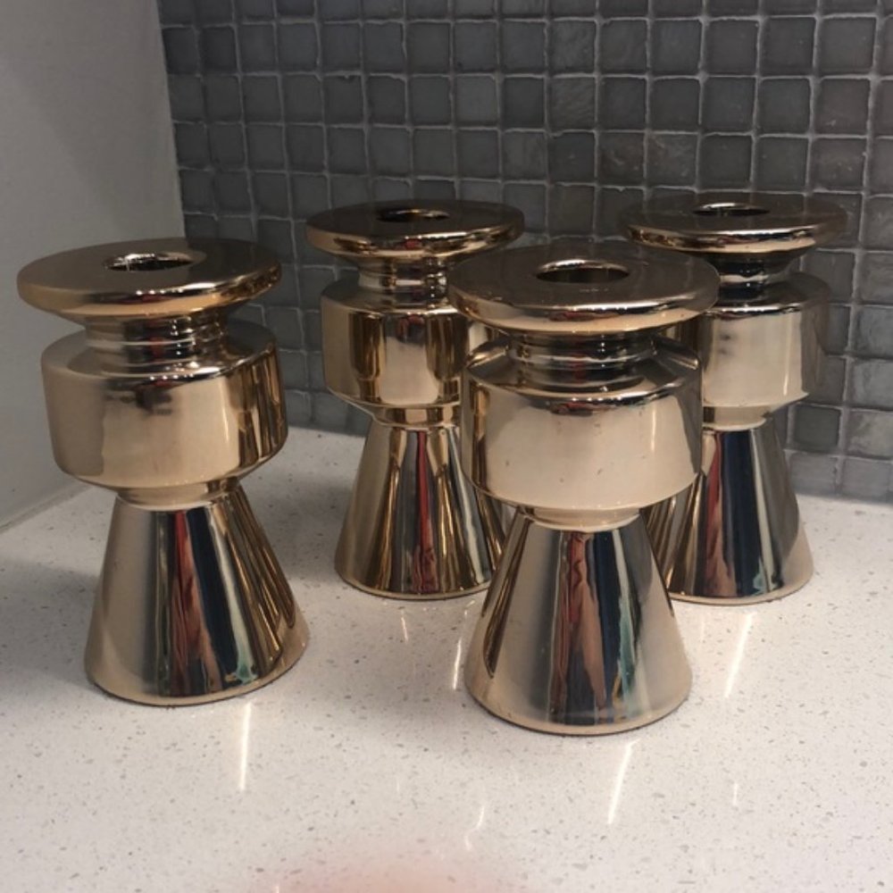 4 gold candle stick holders